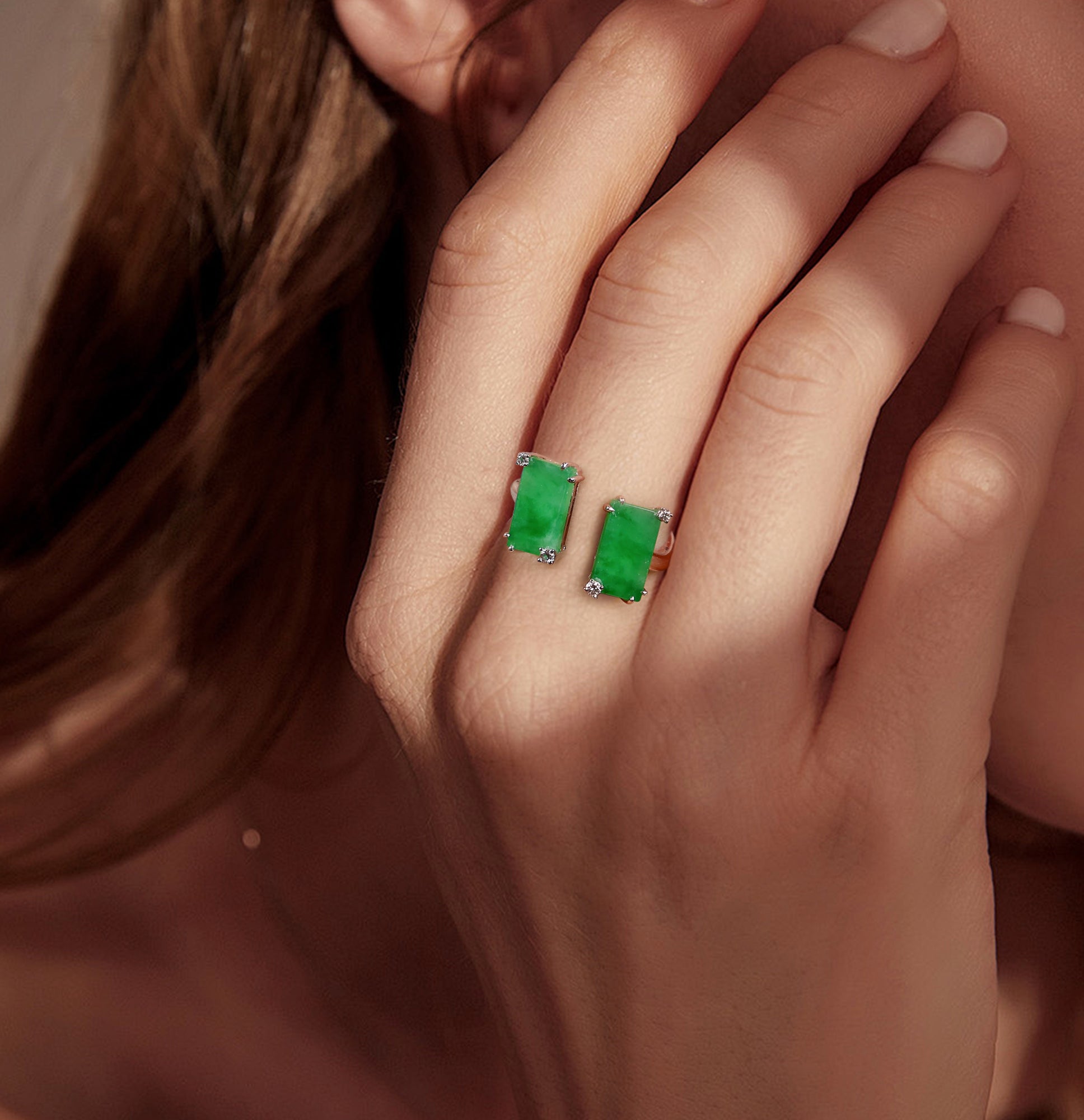 A semi-open jade ring inlaid with two jades and diamonds