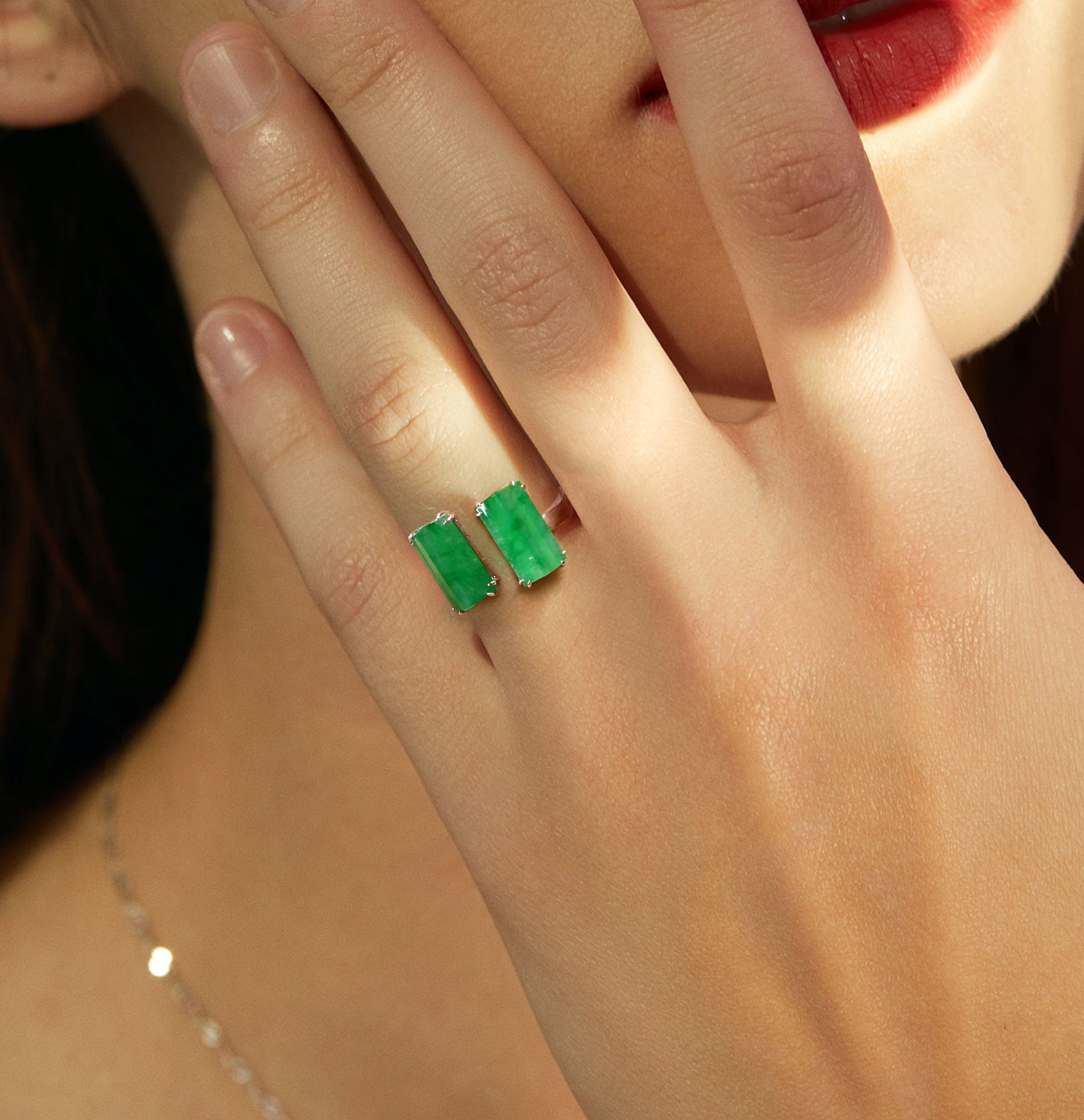 Model wearing a semi-open jade ring with two jade stones