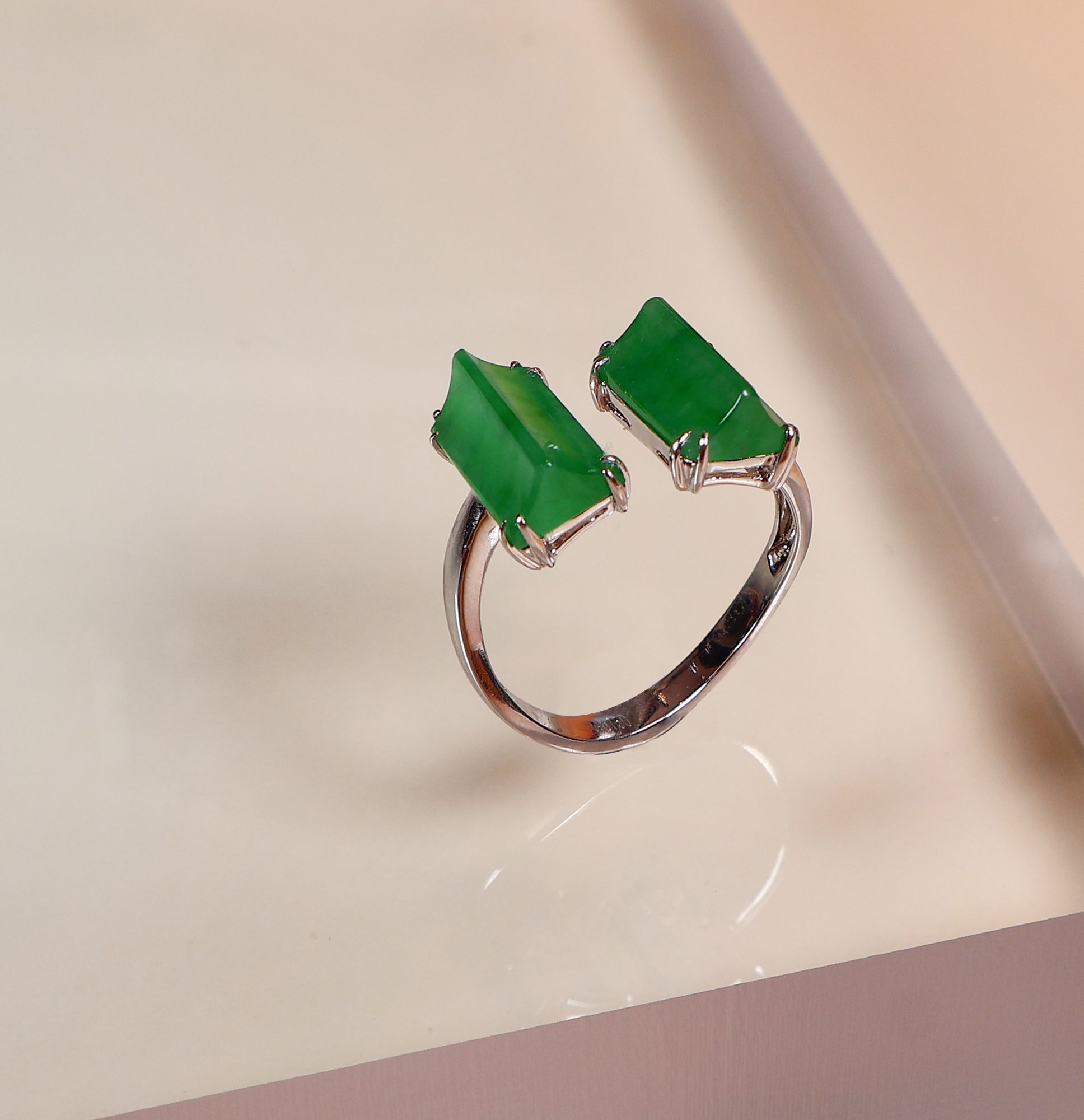 Semi-open jade ring with two jade stones