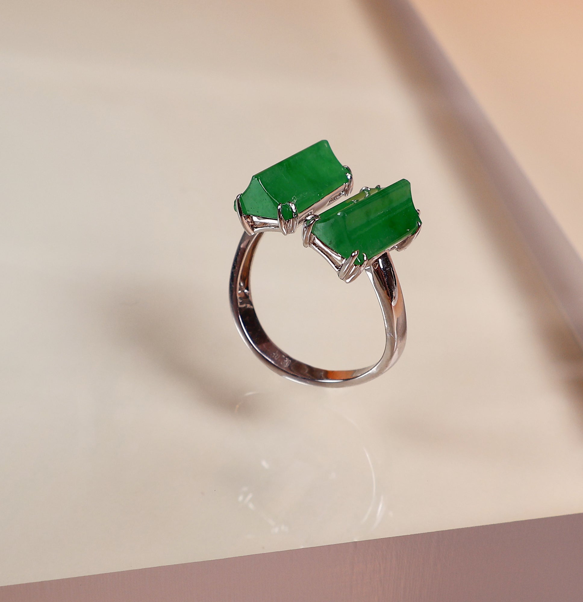 Semi-open jade ring with two jade stones