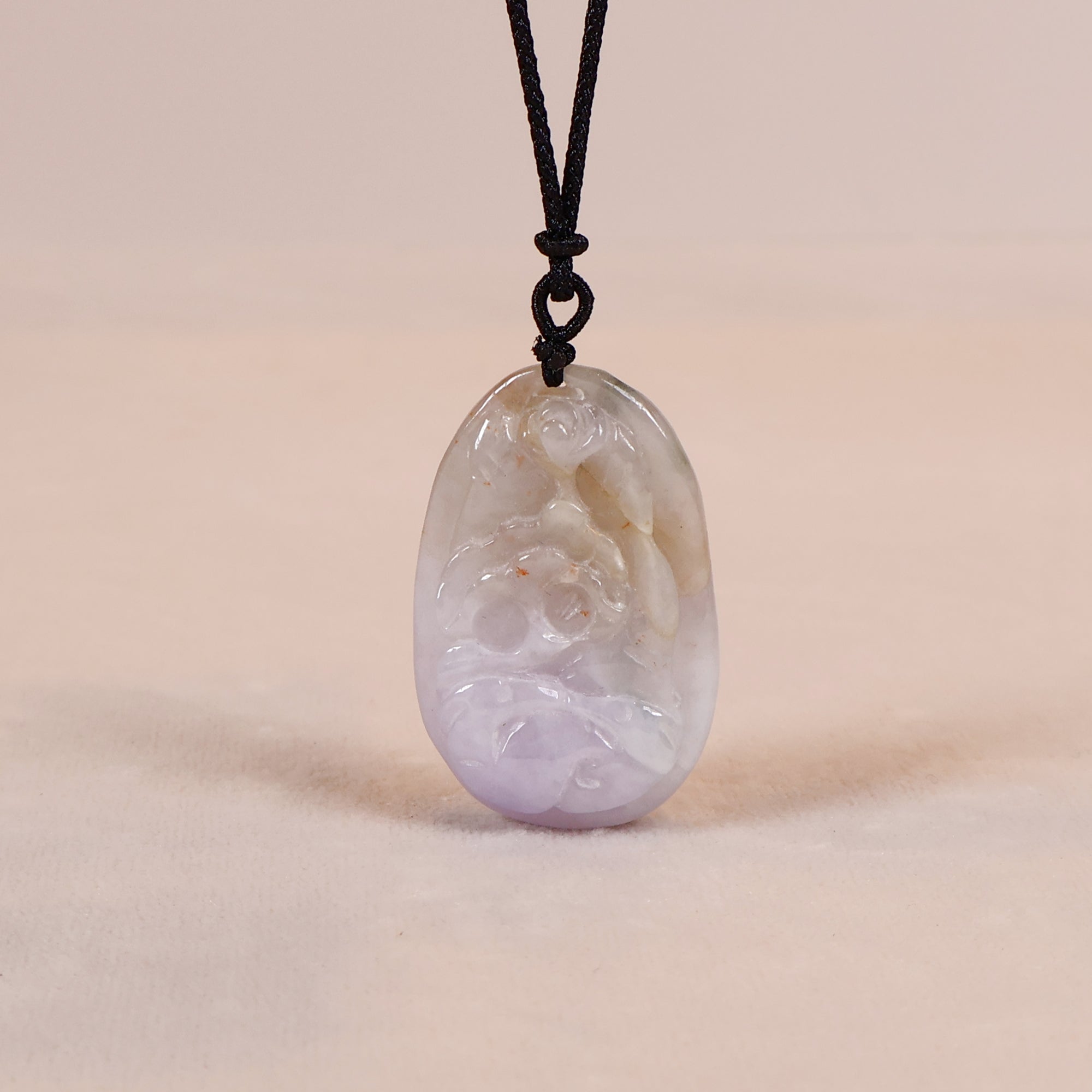 Carved lavender jade pendant deals